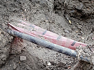 Drink Water Delivering in steel and PVC Plastic Pipes underground. Construction site marked with white red foil