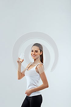 Drink Water. Portrait Of Beautiful Healthy Girl With Beauty Face Drinking Fresh Water In Morning.Young Woman With Glass Of Water.