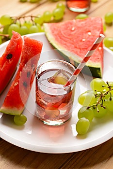 A drink of watermelon and grapes with ice cubes