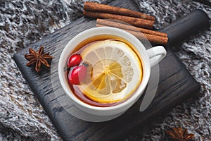 Drink from wild rose berries with lemon and honey cinnamon. Vitamin useful decoction of rose hips. cozy home concept of winter