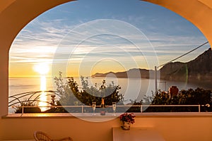 Drinking champagne with view from a luxury apartment on the Mediterranean Sea in Praiano, Amalfi Coast, Campania, Italy, Europe.