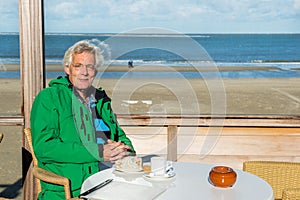 Drinking coffee at the beach