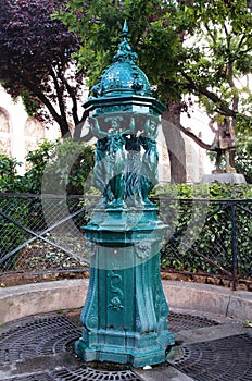 Drinking fountain in Paris, France photo