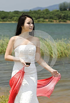 A drinking girl by lake