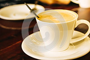 Drinking hot coffee cappuccino in coffee shop