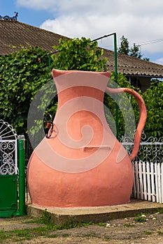 Drinking pitcher-shaped well in front of the house. Symbol of hospitality. The traditional culture of wine villages