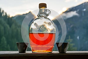 Drinking plum brandy after a long hiking tour in the mountains i
