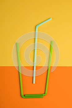 Drinking straws for colored background. Colorful plastic straws used for drinking water or soft drinks