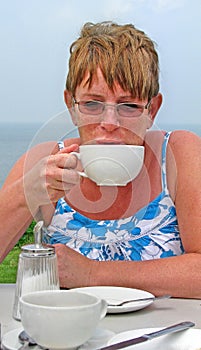 Drinking tea coffee alfresco at beach photo