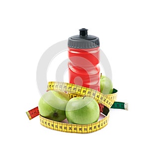 Drinking water bottle and apples