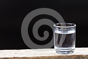 Drinking water on a dark background.