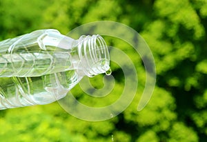 Drinking water drop out from plastic bottle