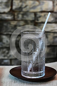 Drinking water in glass on the table