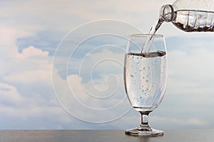 Drinking water poured into the glass.