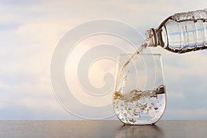 Drinking water poured into the glass.