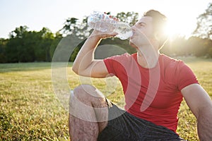 Drinking water and resting after workout