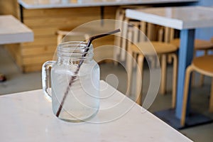 Drinking water in retro glass jar (Mason Jar)