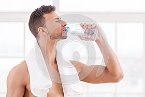 Drinking water after workout.