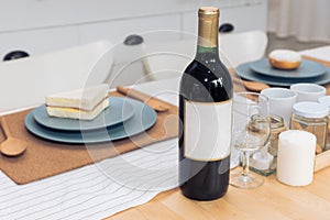 Drinking wine bottle on dining table. Beverage and food concept
