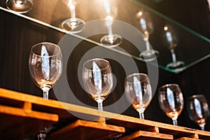 Drinking wine glasses shelf in restaurant with lighting showcase