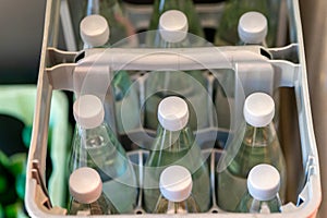 a drinks crate with water bottles