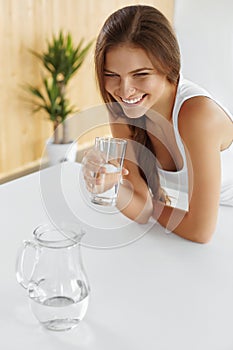 Drinks. Happy Girl Drinking Water. Healthcare. Healthy Lifestyle