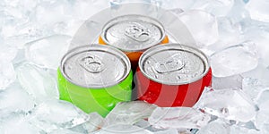 Drinks lemonade cola drink softdrinks in cans with ice cubes panorama