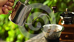 Drip coffee, Close up of coffee brewing on wooden bar counter.