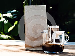 Drip coffee cup with bag coffee, paper dripping bag on a cup