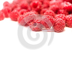 Dripping raspberry on white background.