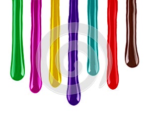 Drips of colorful paint closeup isolated on white background