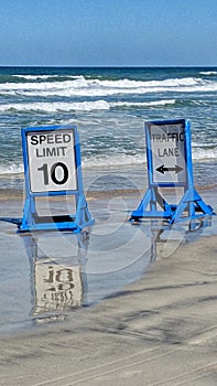 Drive on beach with speed limit sign