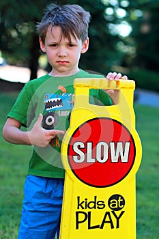 Drive Careful sign with small boy.