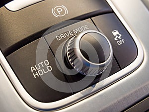 Drive mode selection dial and lock button