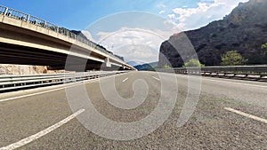 Drive on mountain road with black asphalt. Travel by car, first-person view.