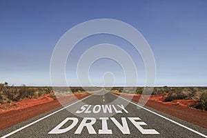 Drive slowly written on the road