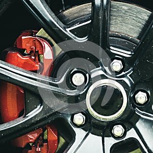 Drive them daily, not just to the shows. Wheel and rim. Front or rear. Car wheel detail. Alloy wheel. Gloss black rim of