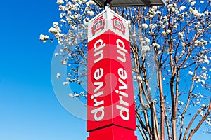 Drive Up vertical signpost informs Target supermarket online shoppers about reserved parking spot for contactless orders pick up