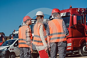 Driver and booker of heavy transport cargo company photo