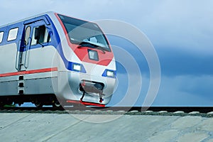 The driver cab on the rails in cloudy weather during the day