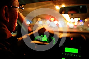 Driver in car at night