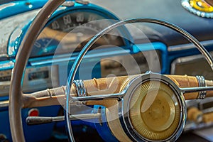 Driver cockpit and the steering wheel of a vintage car