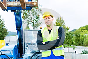 Driver driving construction excavator
