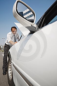 Driver Fixing Engine Breakdown Of White Car With Open Hood