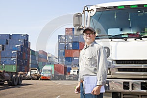 driver in front of container truck