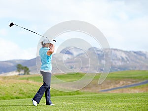 Driver, girl or golfer playing golf for fitness, workout or exercise with a swing on a green course. Wellness, woman