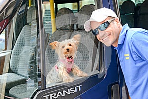 Driver with his dog on a bus at Victoria