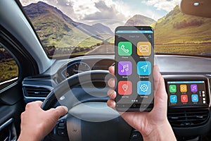 Driver holding smart phone with modern app phone with a modern apps photo