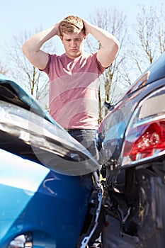 Driver Inspecting Damage After Traffic Accident