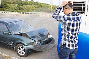 Driver looking the car After Traffic Accident